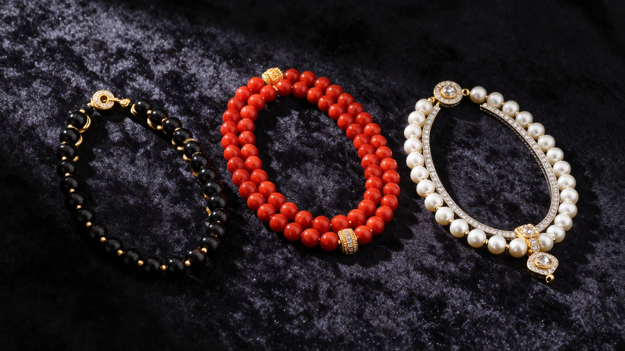 Three styles of mangalsutra: black bead, red coral, and white pearl