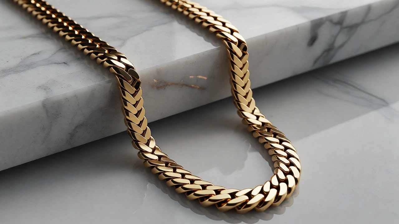Sleek Italian gold chains draped elegantly on a marble surface under soft studio lighting.